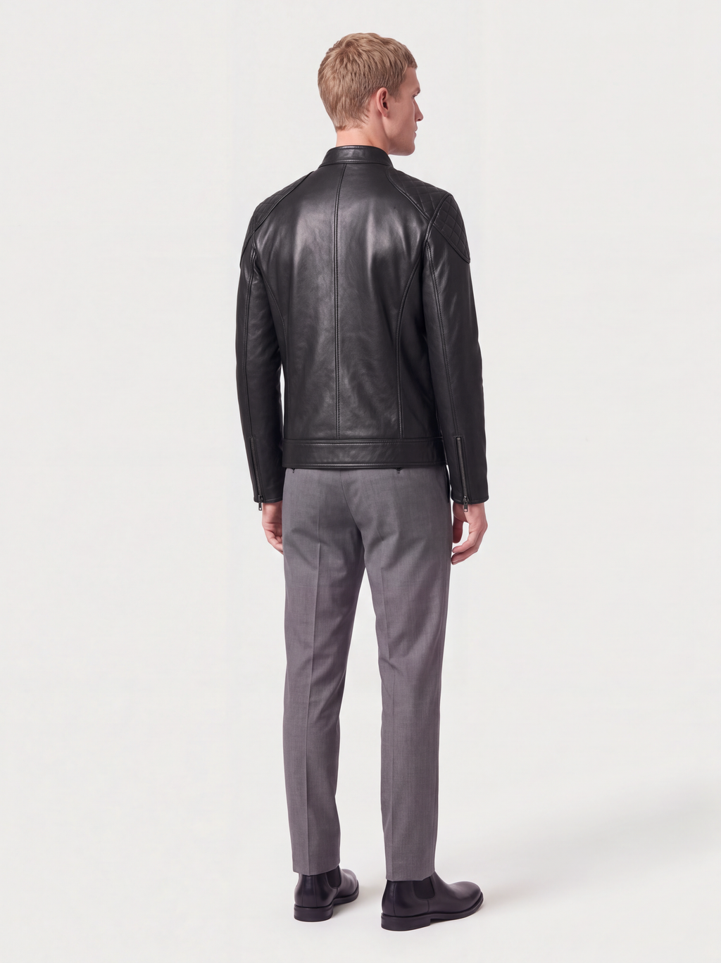 Men's black lambskin racer jacket with quilted shoulders, worn, back view